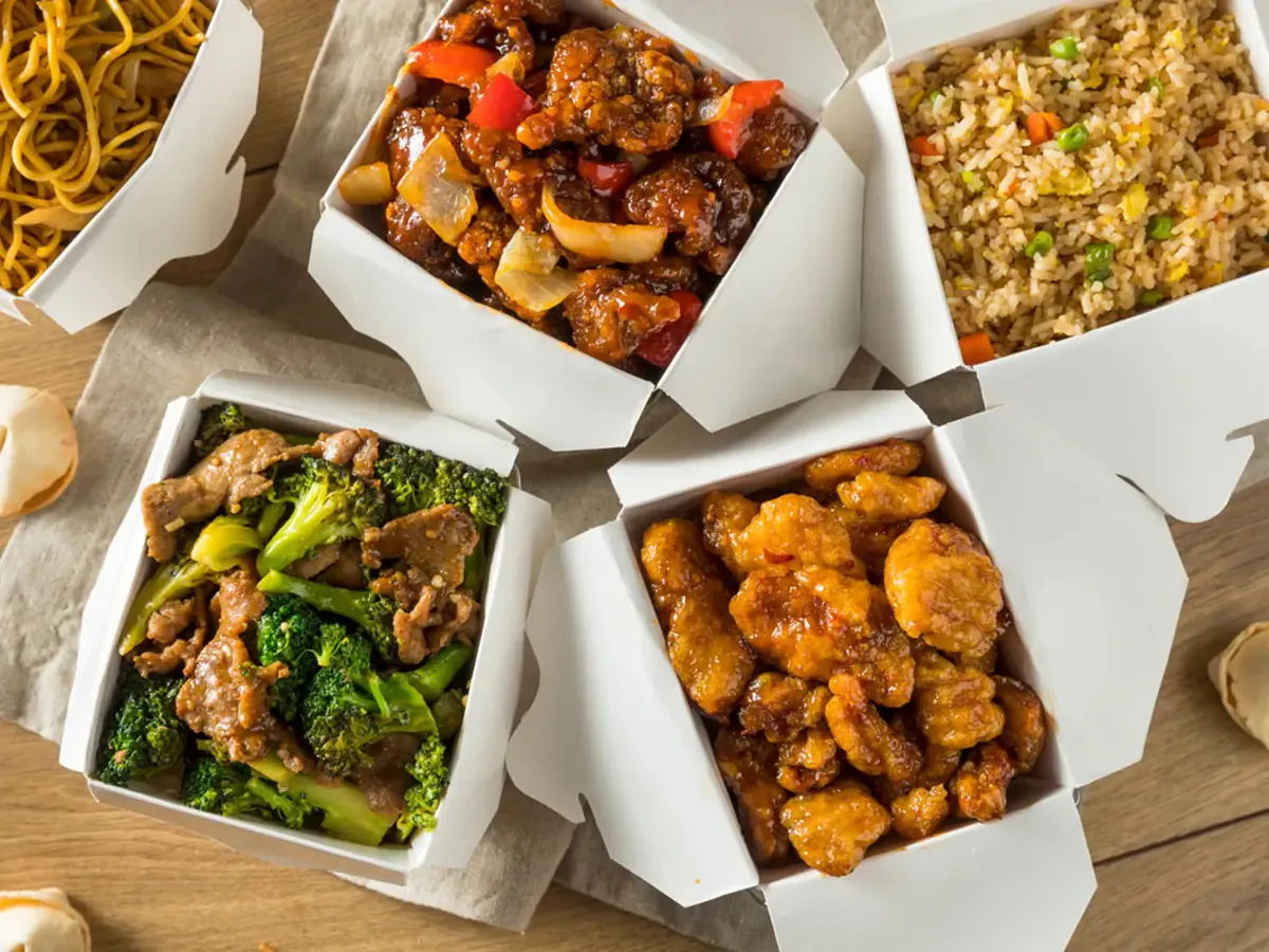 Assorted Chinese takeout dishes including fried noodles and orange chicken at Pokéloha, a Asian Fusion Restaurant in Woonsocket